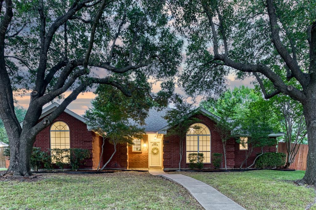 215 Barbara Way Red Oak, TX 75154 - Photo 3 of 36 Welcoming front elevation with shade and character, creating a comfortable sense of arrival before you even step inside.