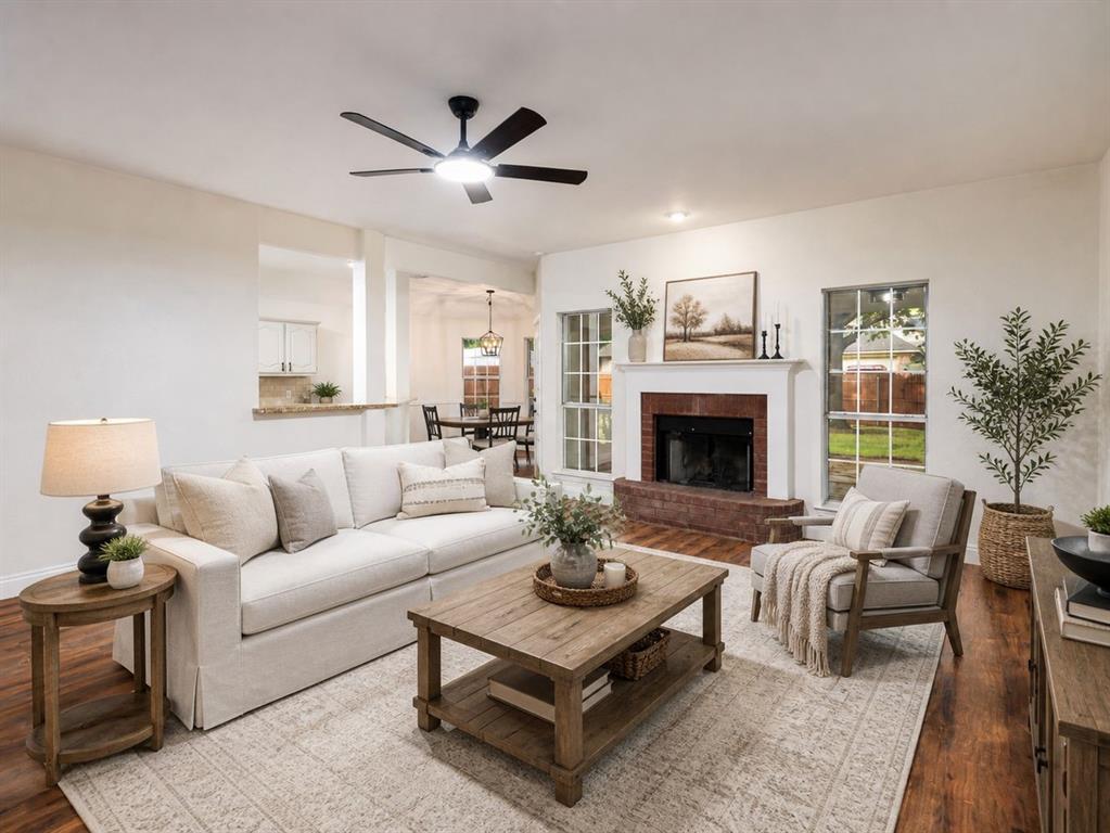 215 Barbara Way Red Oak, TX 75154 - Photo 7 of 36 Virtually staged living room shows the potential for a cozy gathering space, with room to relax, entertain, and enjoy the fireplace as a focal point.