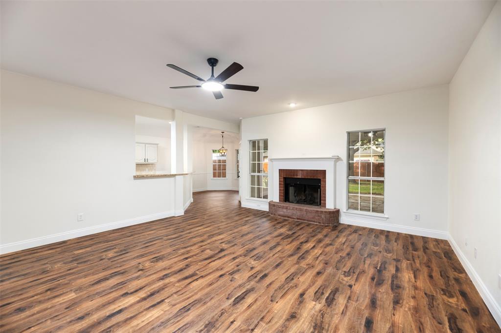 215 Barbara Way Red Oak, TX 75154 - Photo 8 of 36 Open living area offers flexible furniture placement, allowing buyers to imagine both everyday comfort and casual entertaining.