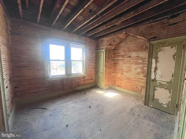 a view of an empty room with a fireplace