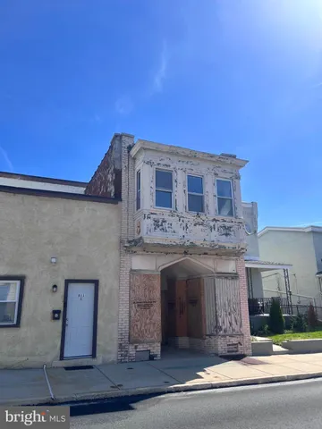 a front view of a house with yard