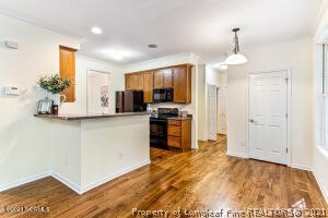 Undisclosed Address Pinehurst, NC 28374 - Photo 11 of 29 a kitchen with kitchen island a counter top space appliances and cabinets