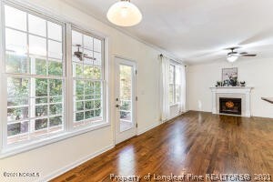Undisclosed Address Pinehurst, NC 28374 - Photo 13 of 29 a view of an empty room with wooden floor and a window