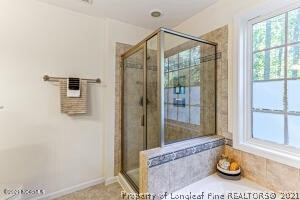 Undisclosed Address Pinehurst, NC 28374 - Photo 17 of 29 a bathroom with a tub and shower