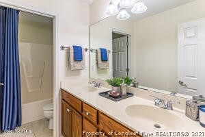 Undisclosed Address Pinehurst, NC 28374 - Photo 24 of 29 a bathroom with a sink double vanity and a mirror
