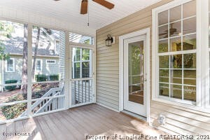 Undisclosed Address Pinehurst, NC 28374 - Photo 27 of 29 a view of front door and porch with wooden floor
