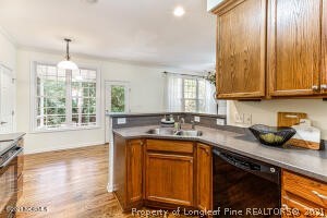 Undisclosed Address Pinehurst, NC 28374 - Photo 8 of 29 a kitchen with sink cabinets and window