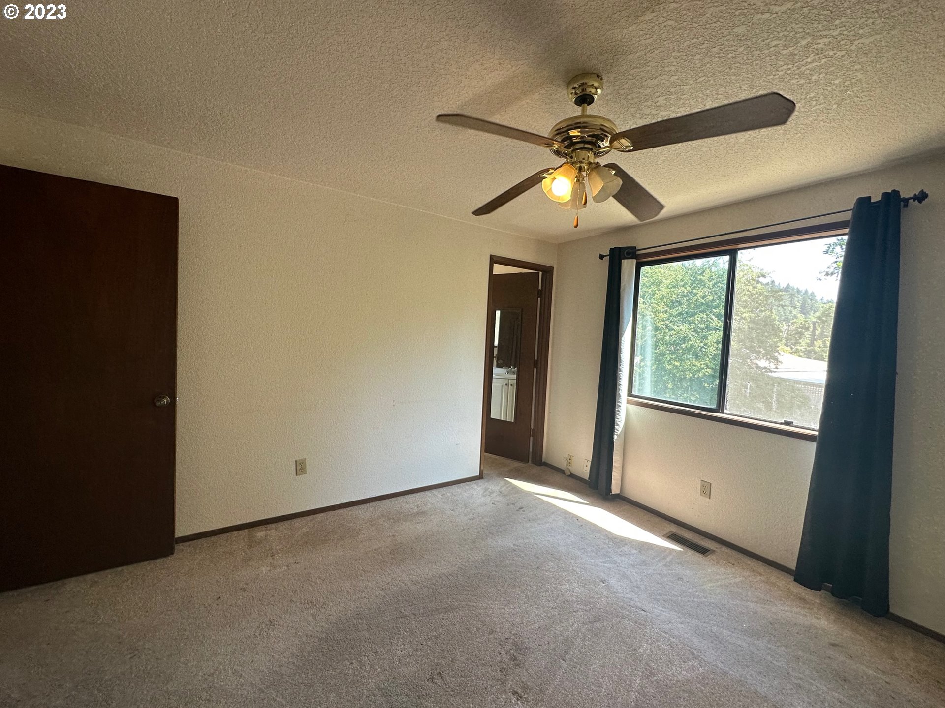 13922 Southeast Bush Street Portland, OR 97236 - Photo 17 of 29 a view of an empty room with a window