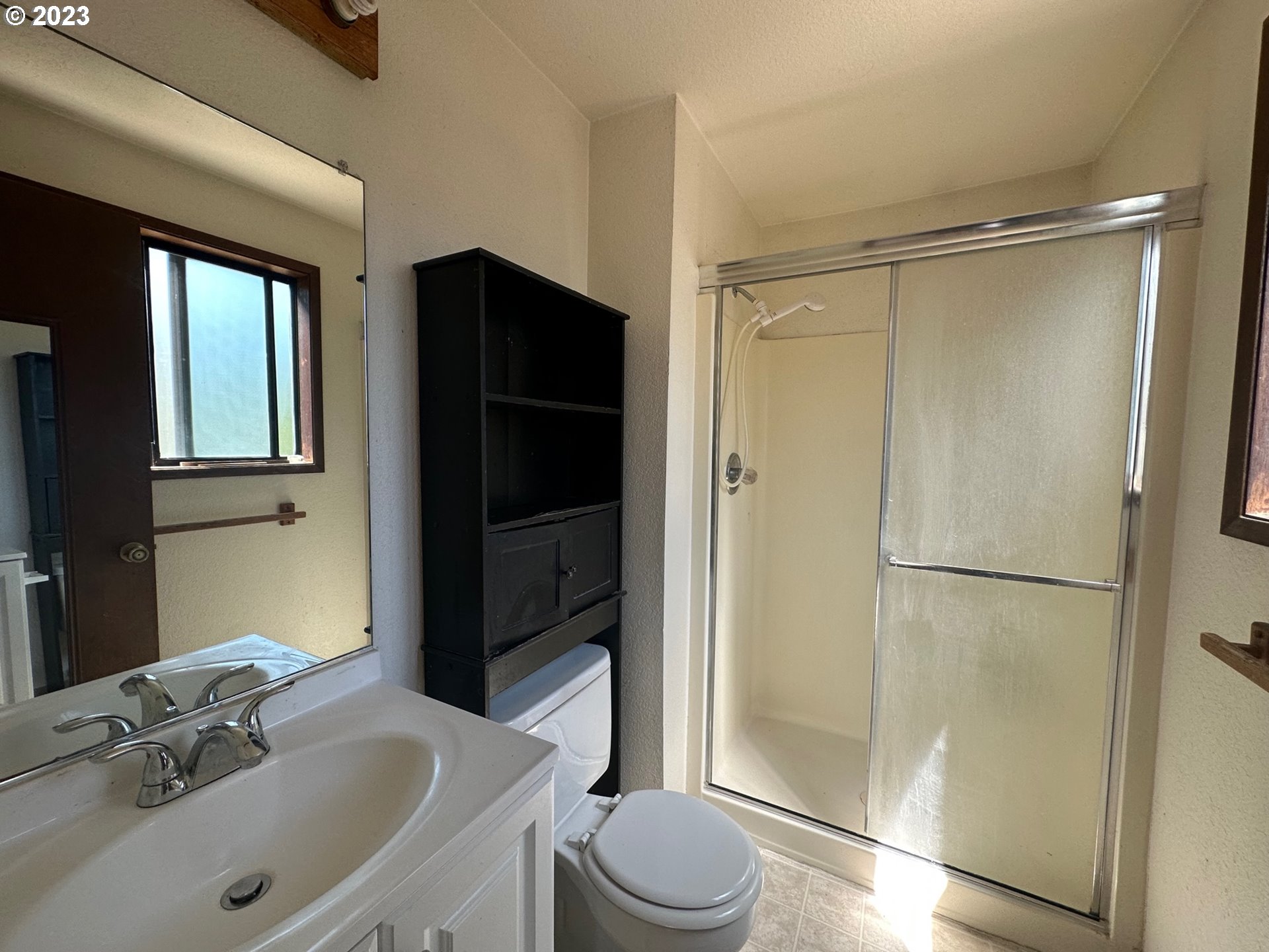 13922 Southeast Bush Street Portland, OR 97236 - Photo 19 of 29 a bathroom with a sink toilet and shower