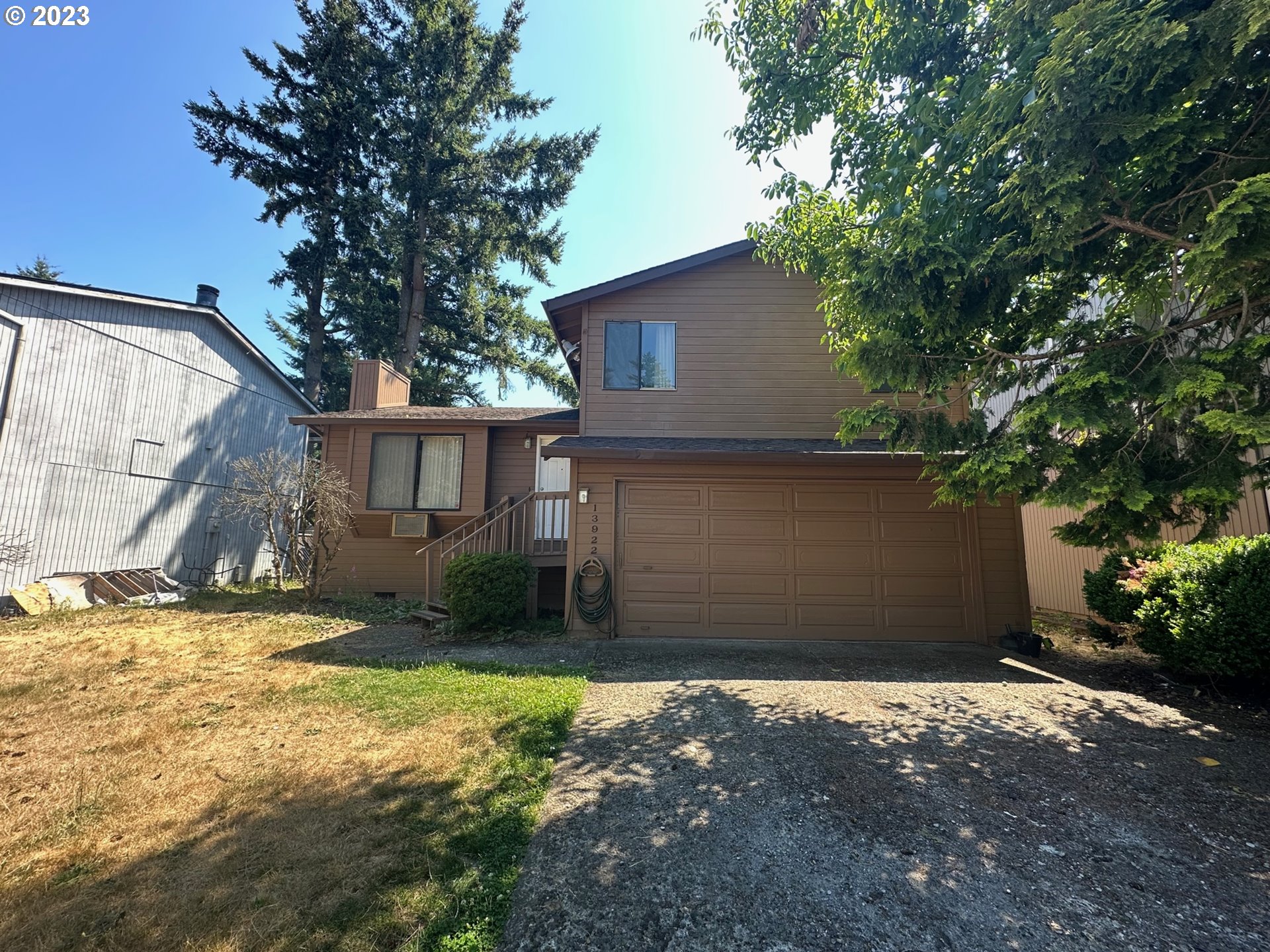 13922 Southeast Bush Street Portland, OR 97236 - Photo 2 of 29 a view of a house with a yard