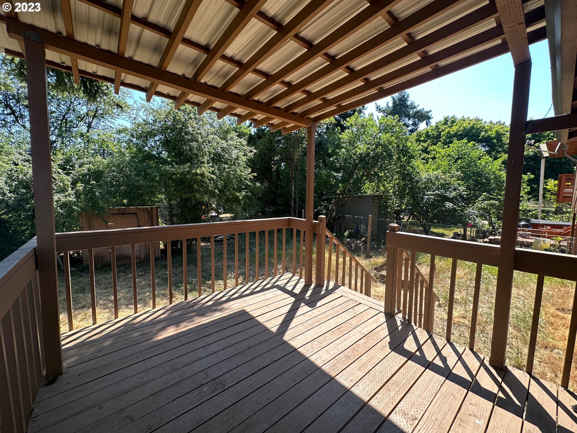 13922 Southeast Bush Street Portland, OR 97236 - Photo 24 of 29 a view of balcony with wooden floor