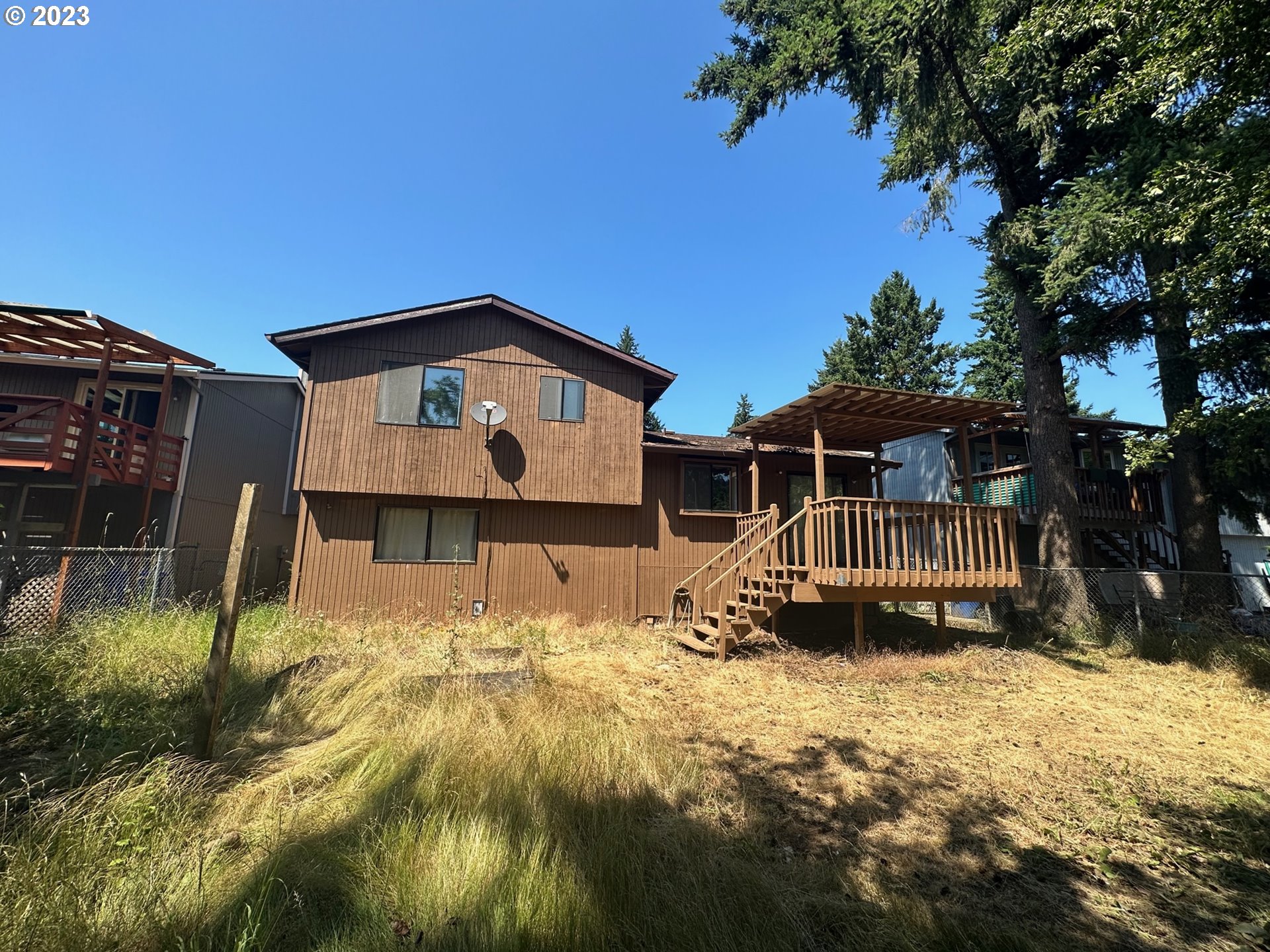 13922 Southeast Bush Street Portland, OR 97236 - Photo 28 of 29 a front view of a house with a yard