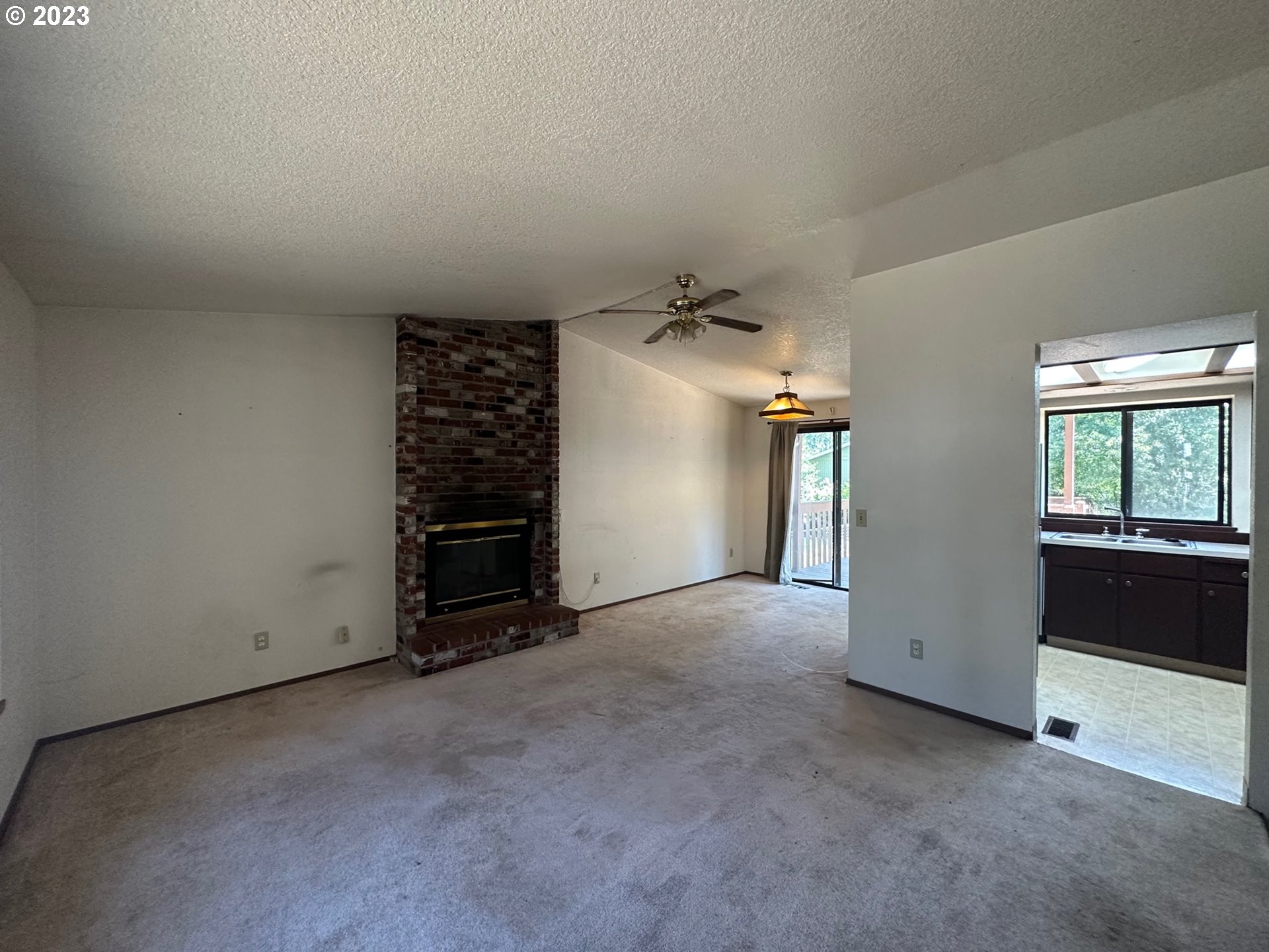 13922 Southeast Bush Street Portland, OR 97236 - Photo 5 of 29 an empty room with closet and natural light