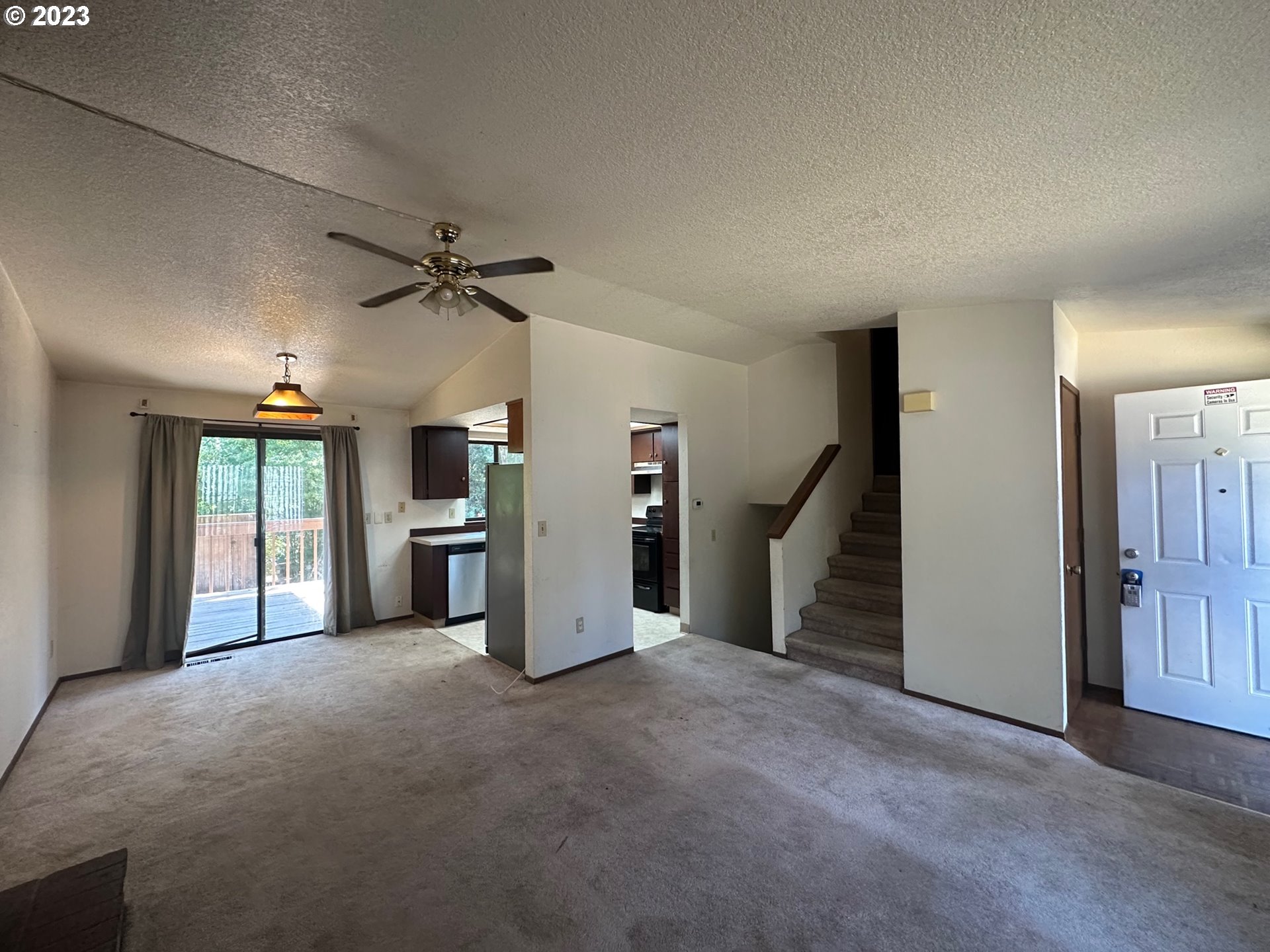 13922 Southeast Bush Street Portland, OR 97236 - Photo 7 of 29 a view of a livingroom with a ceiling fan and window