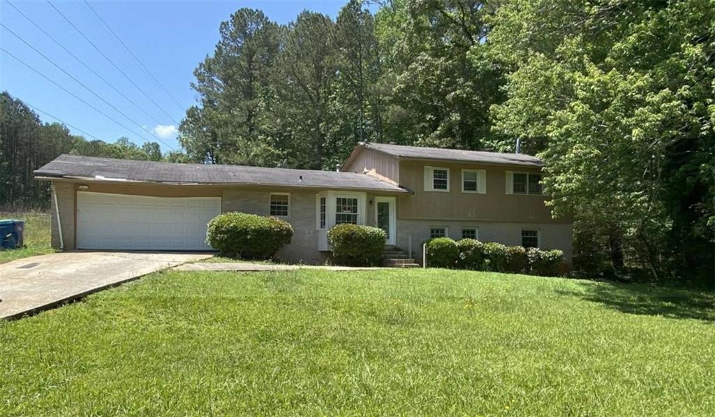 180 North Star Trail Southwest South Fulton, GA 30331 - Photo 1 of 1 a front view of a house with yard and green space
