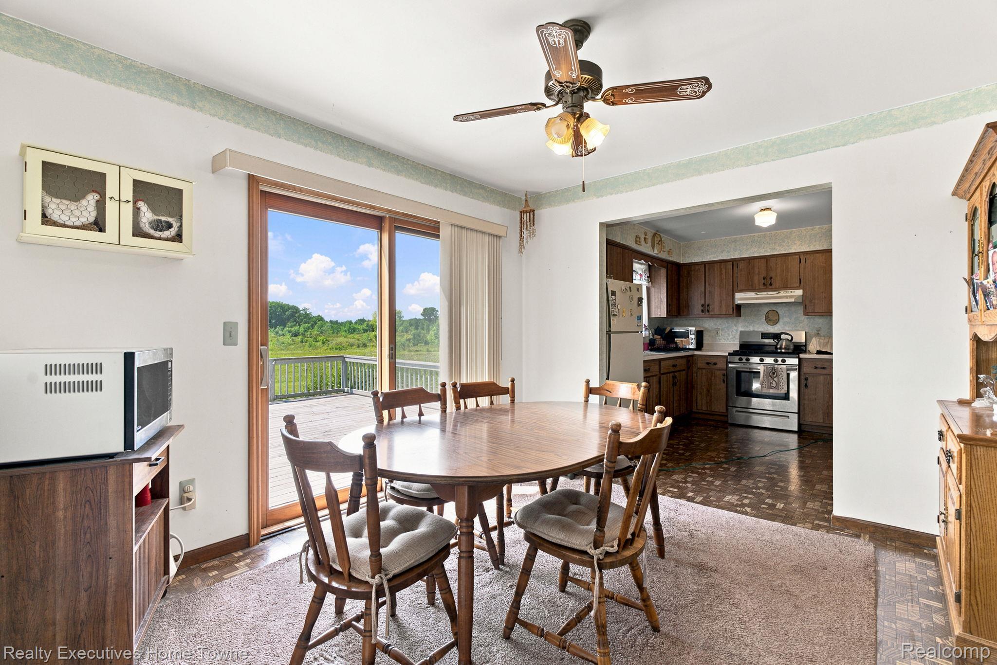 959 Braidwood Road Memphis, MI 48041 - Photo 18 of 58 Dining area featuring direct access to an outdoor deck through sliding glass doors