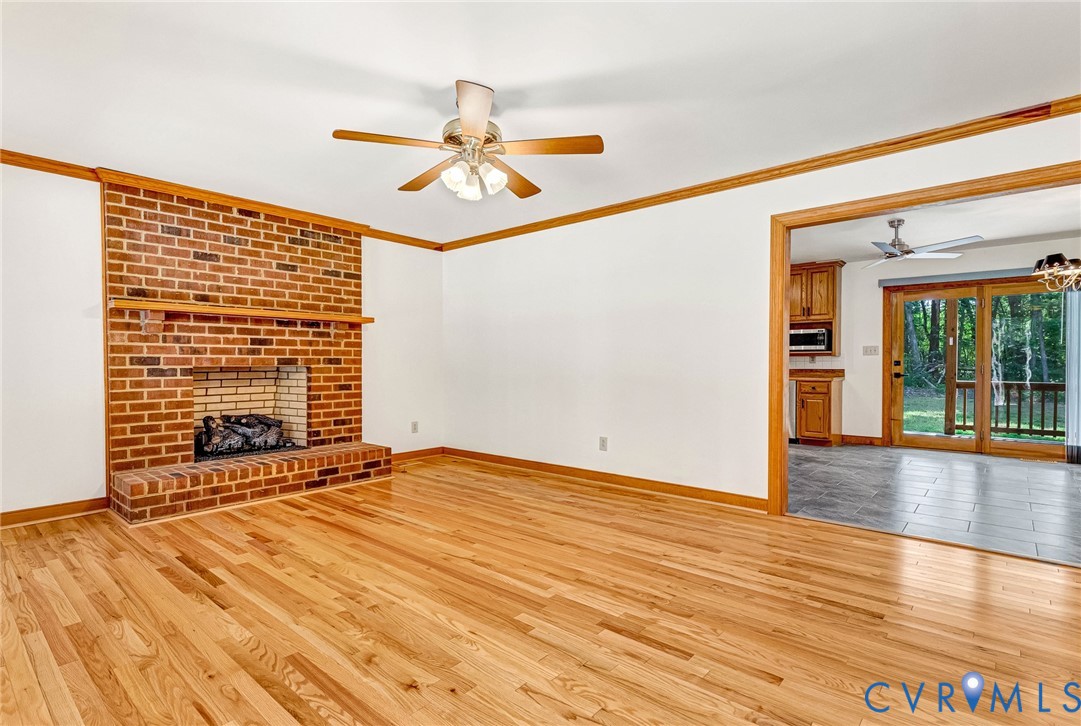 15321 Goshen Road Montpelier, VA 23192 - Photo 6 of 36 Hardwood flooring, brick fireplace with mantel, ce