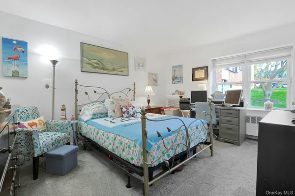 a room with furniture and a flat screen tv