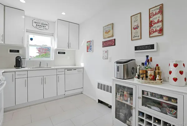 a kitchen with cabinets and window