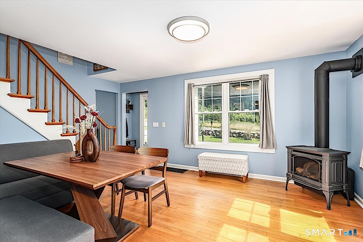 313 Torrington Road Litchfield, CT 06759 - Photo 3 of 26 Sun-Filled Dining Room with Propane Fireplace