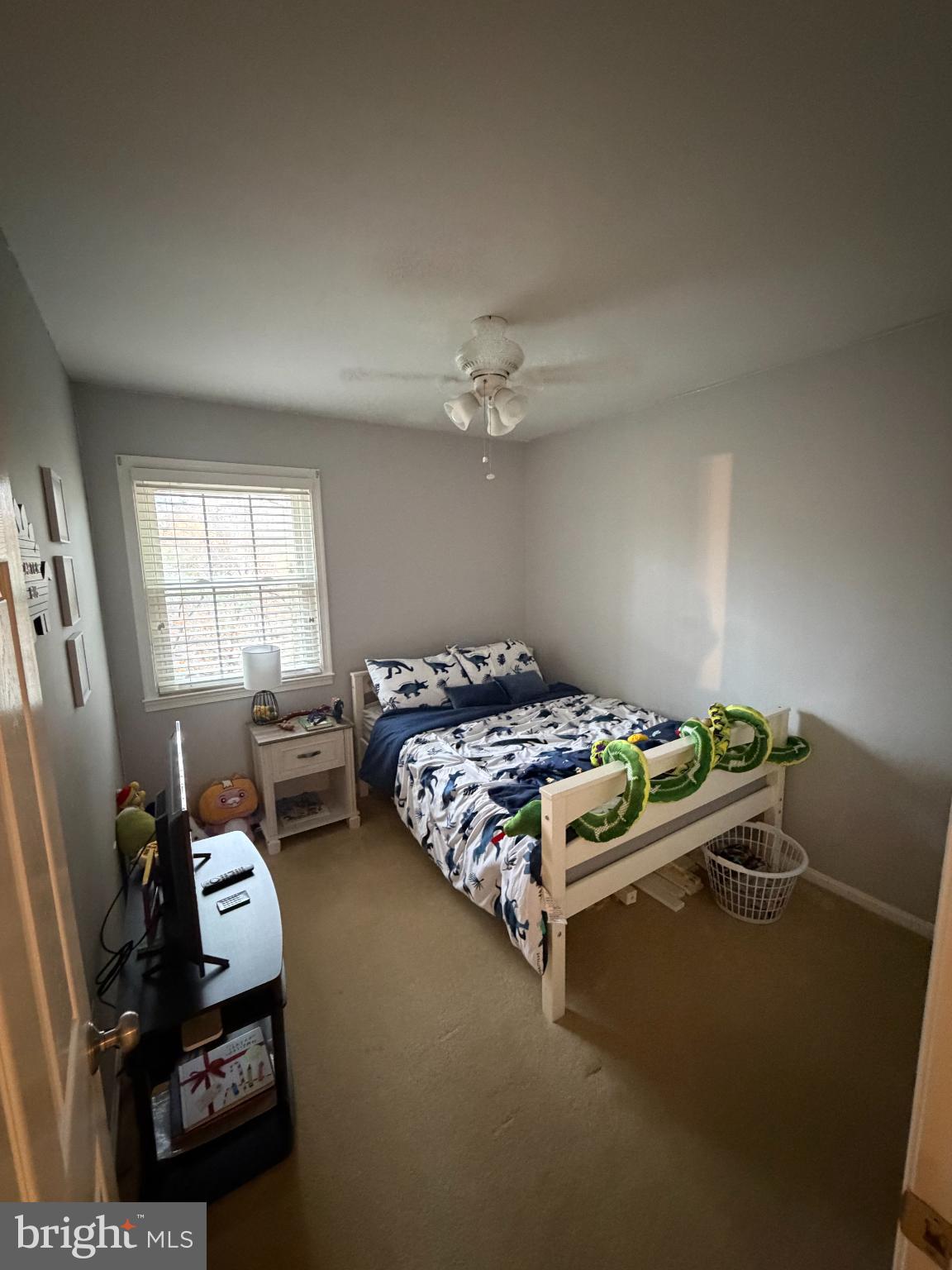 6036 Old Landing Way Burke, VA 22015 - Photo 13 of 19 a bed sitting in a bedroom next to a window