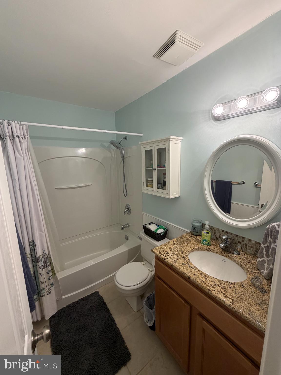 6036 Old Landing Way Burke, VA 22015 - Photo 14 of 19 a bathroom with a sink a toilet a mirror and shower