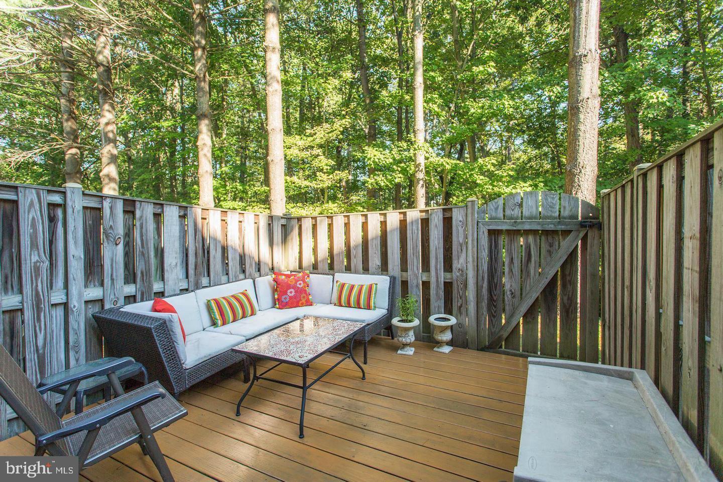 6036 Old Landing Way Burke, VA 22015 - Photo 16 of 19 a outdoor sitting area with furniture and wooden floor