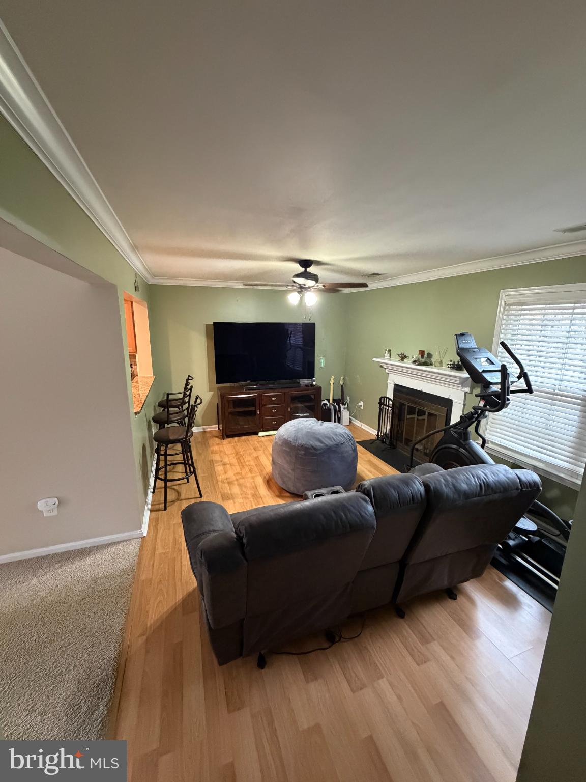 6036 Old Landing Way Burke, VA 22015 - Photo 4 of 19 a living room with furniture and a flat screen tv