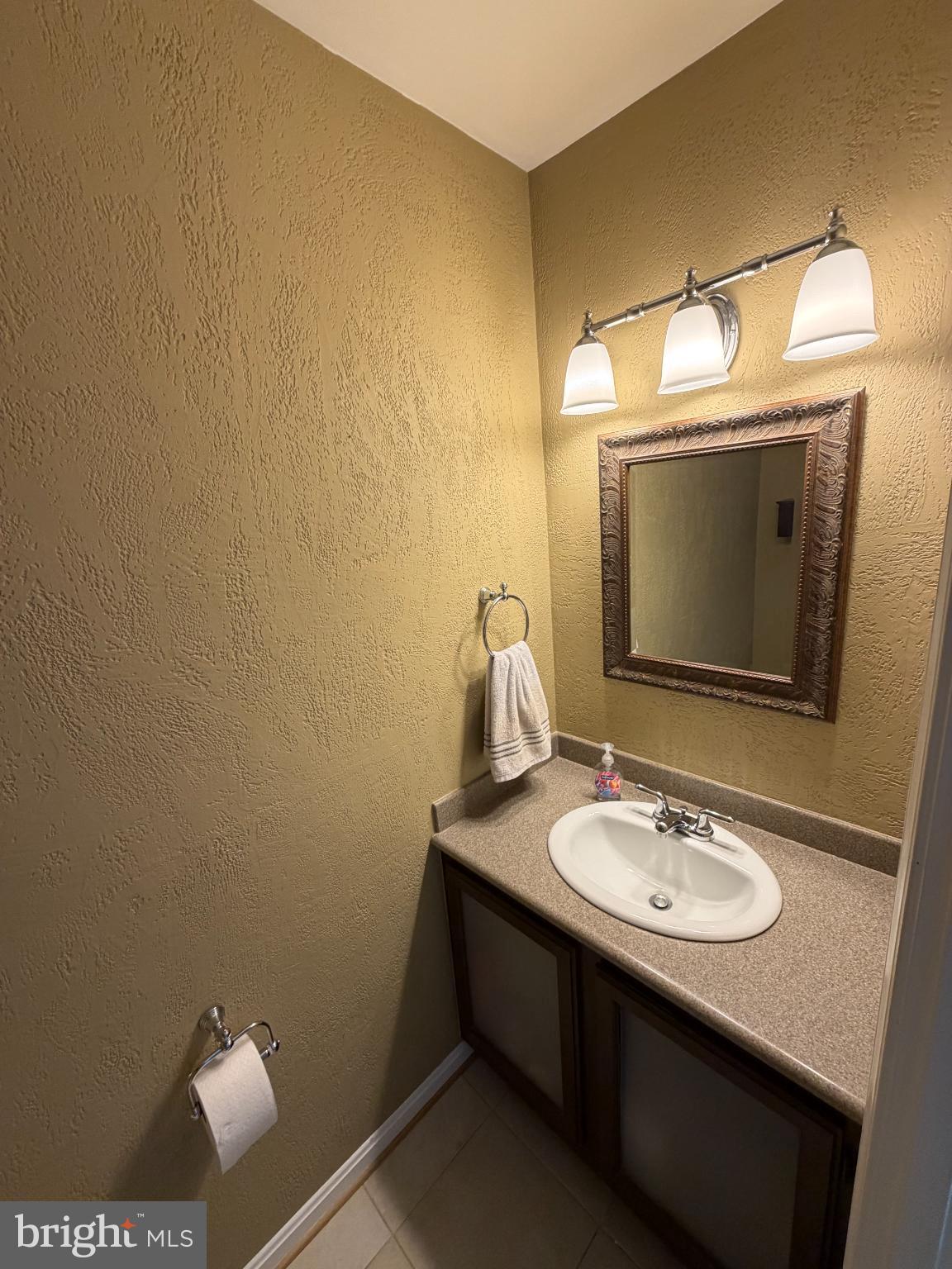 6036 Old Landing Way Burke, VA 22015 - Photo 8 of 19 a bathroom with a sink toilet and mirror