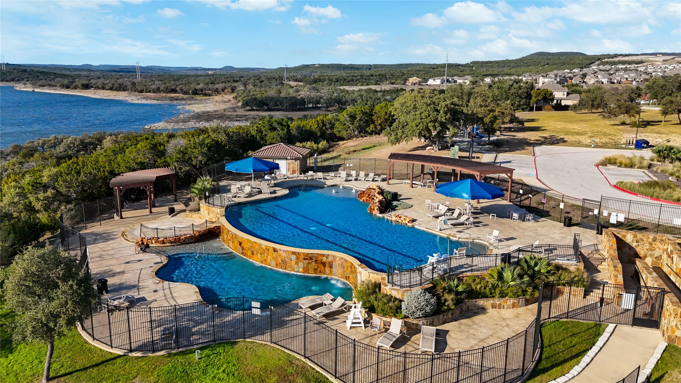 7705 Pace Ravine Drive Lago Vista, TX 78645 - Photo 36 of 40 Community pool with a patio area and a mountain view