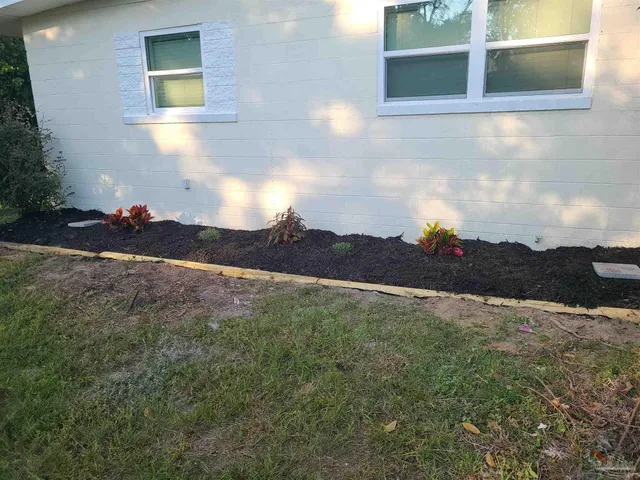 a view of a big room with windows