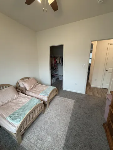 a bedroom with double bed and a walk in closet