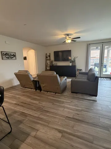 a living room with furniture fireplace and flat screen tv