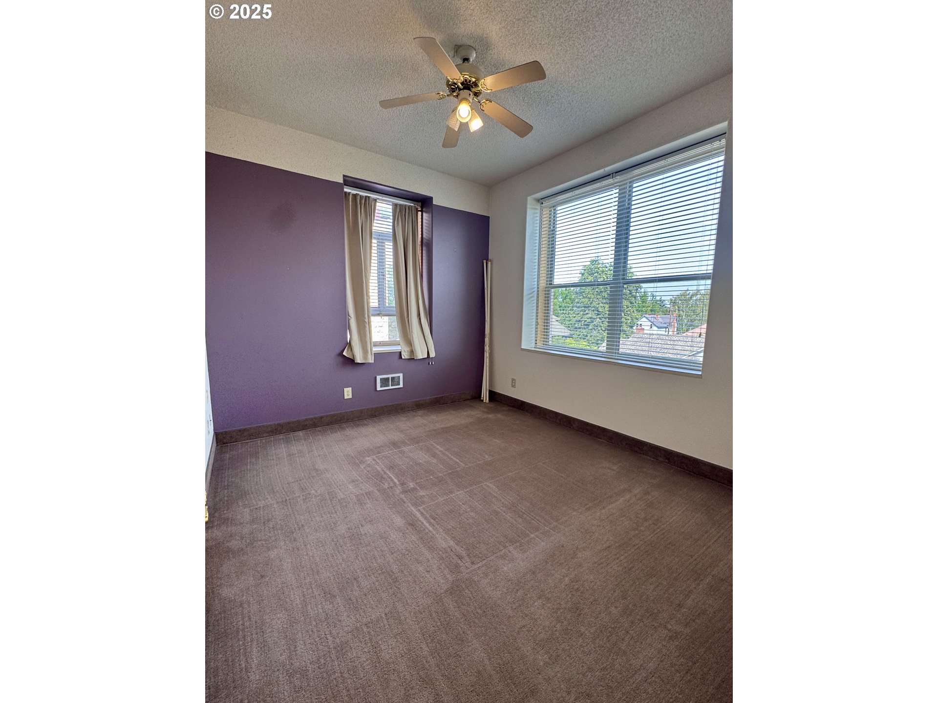 2365 4th Street Baker City, OR 97814 - Photo 14 of 27 a view of a livingroom with a ceiling fan and window