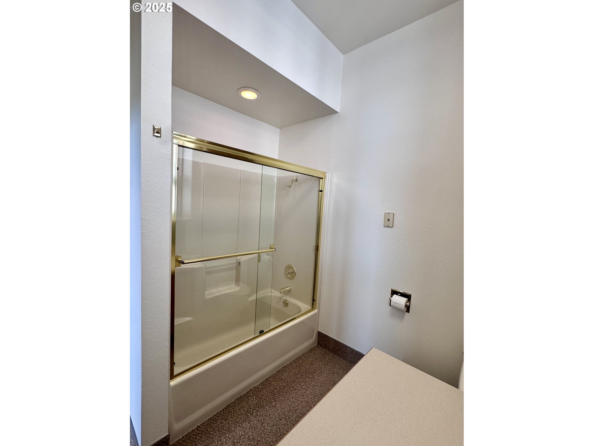 2365 4th Street Baker City, OR 97814 - Photo 16 of 27 a bathroom with a glass shower door