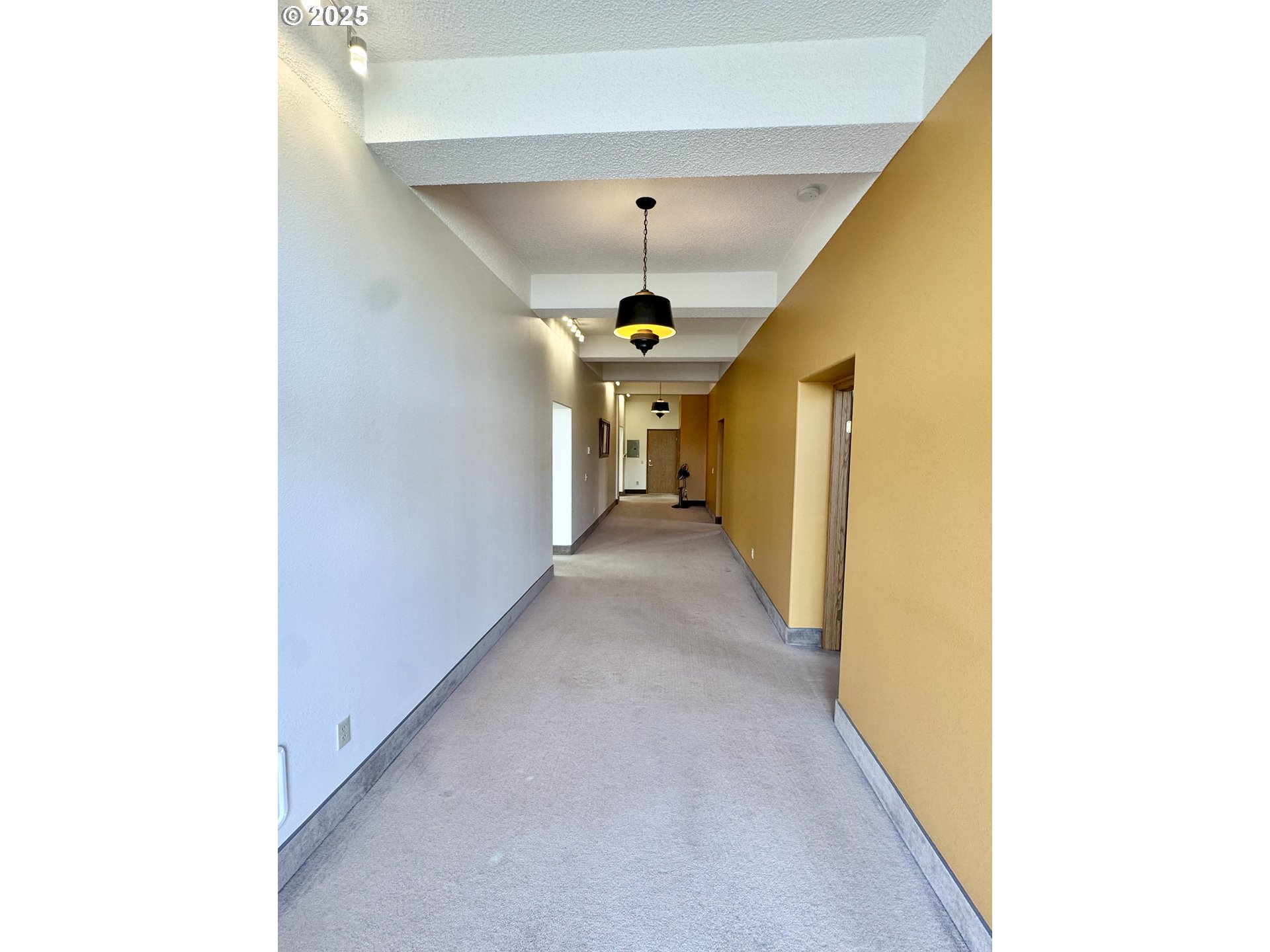 2365 4th Street Baker City, OR 97814 - Photo 17 of 27 a view of a hallway with a chandelier