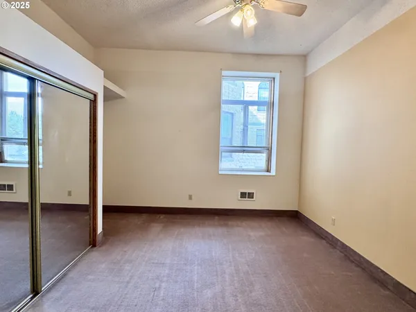 a view of a room with large windows