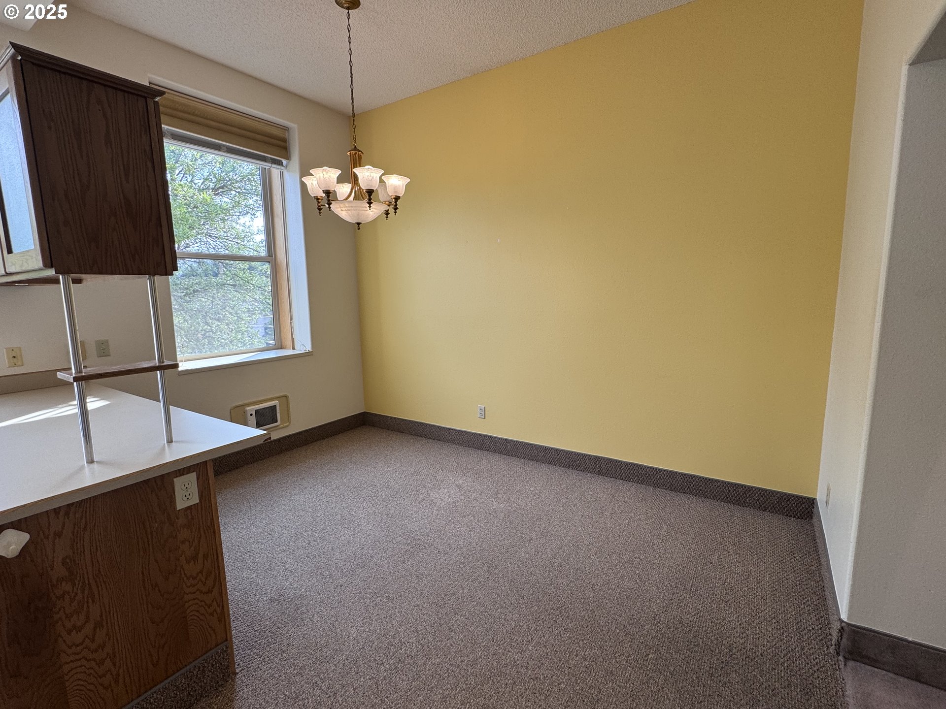 2365 4th Street Baker City, OR 97814 - Photo 4 of 27 a view of a room with a chandelier fan and windows