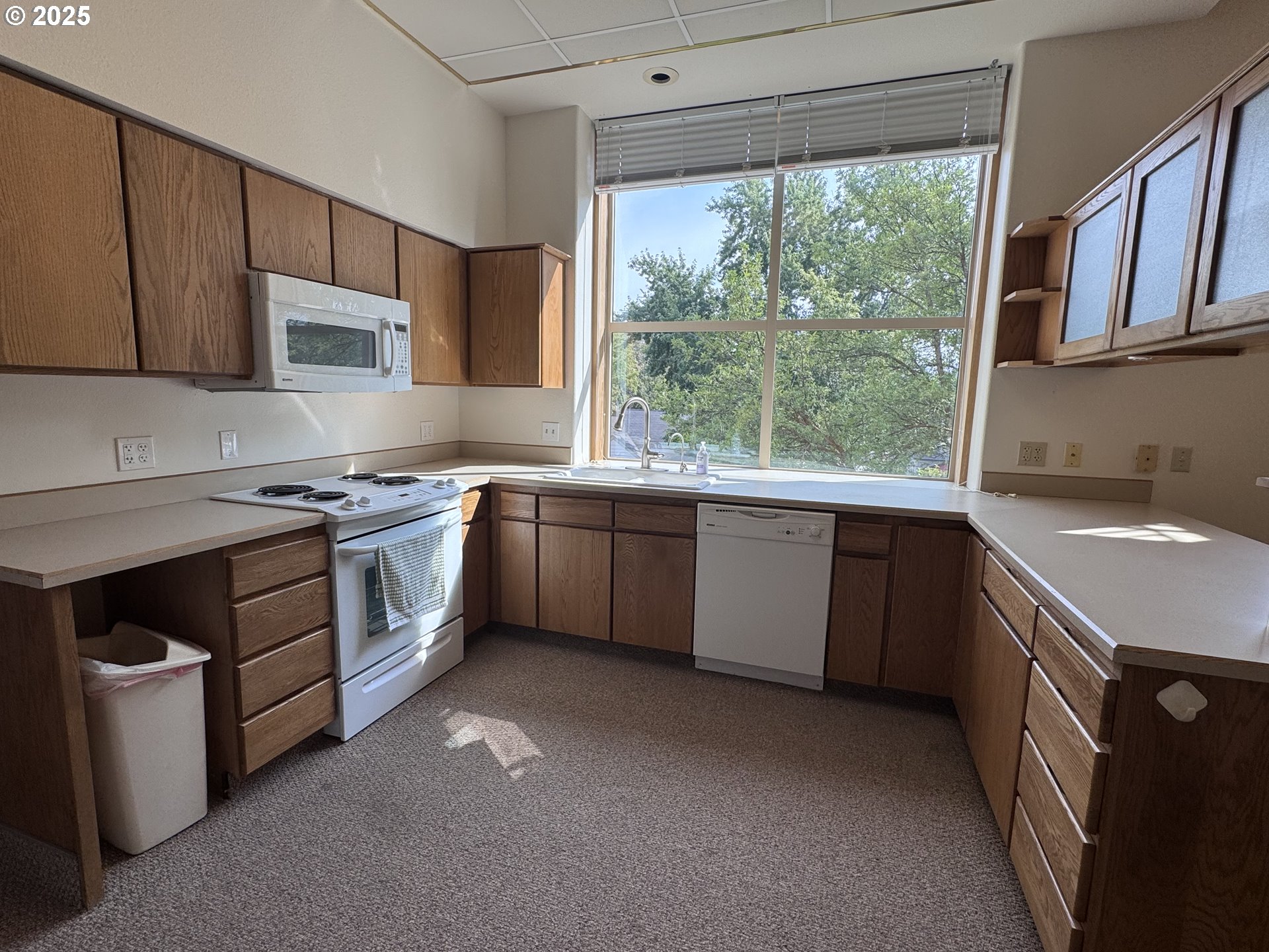 2365 4th Street Baker City, OR 97814 - Photo 6 of 27 a kitchen with a sink stove top oven and cabinets