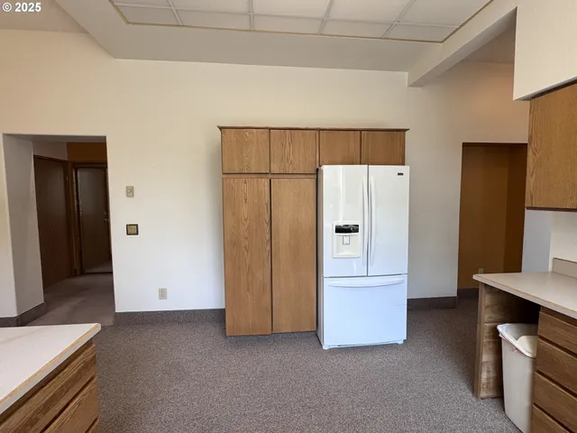a view of a bathroom with a tub and mirror