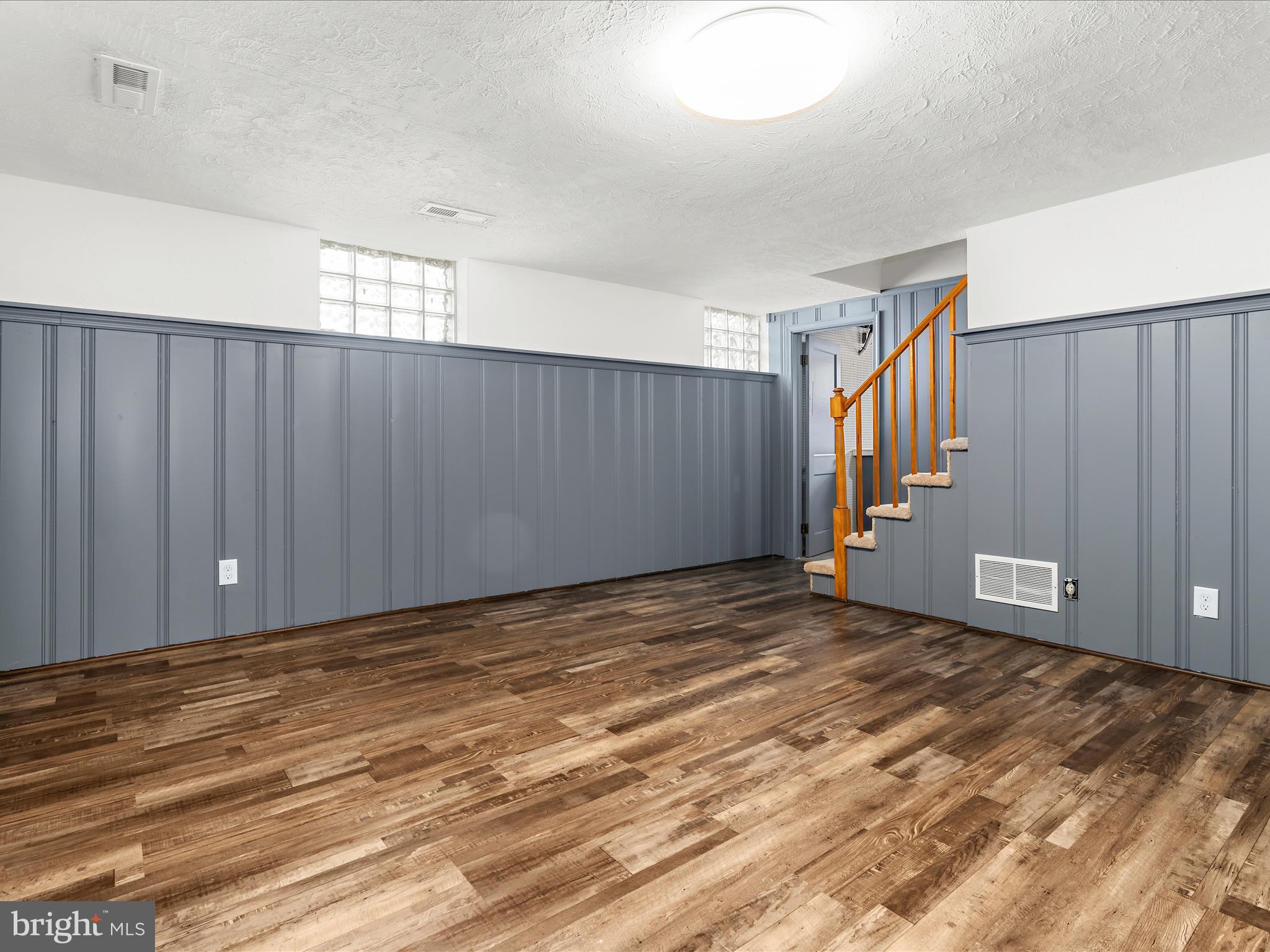 7821 Rockbourne Road Baltimore, MD 21222 - Photo 14 of 56 a view of an empty room with wooden floor