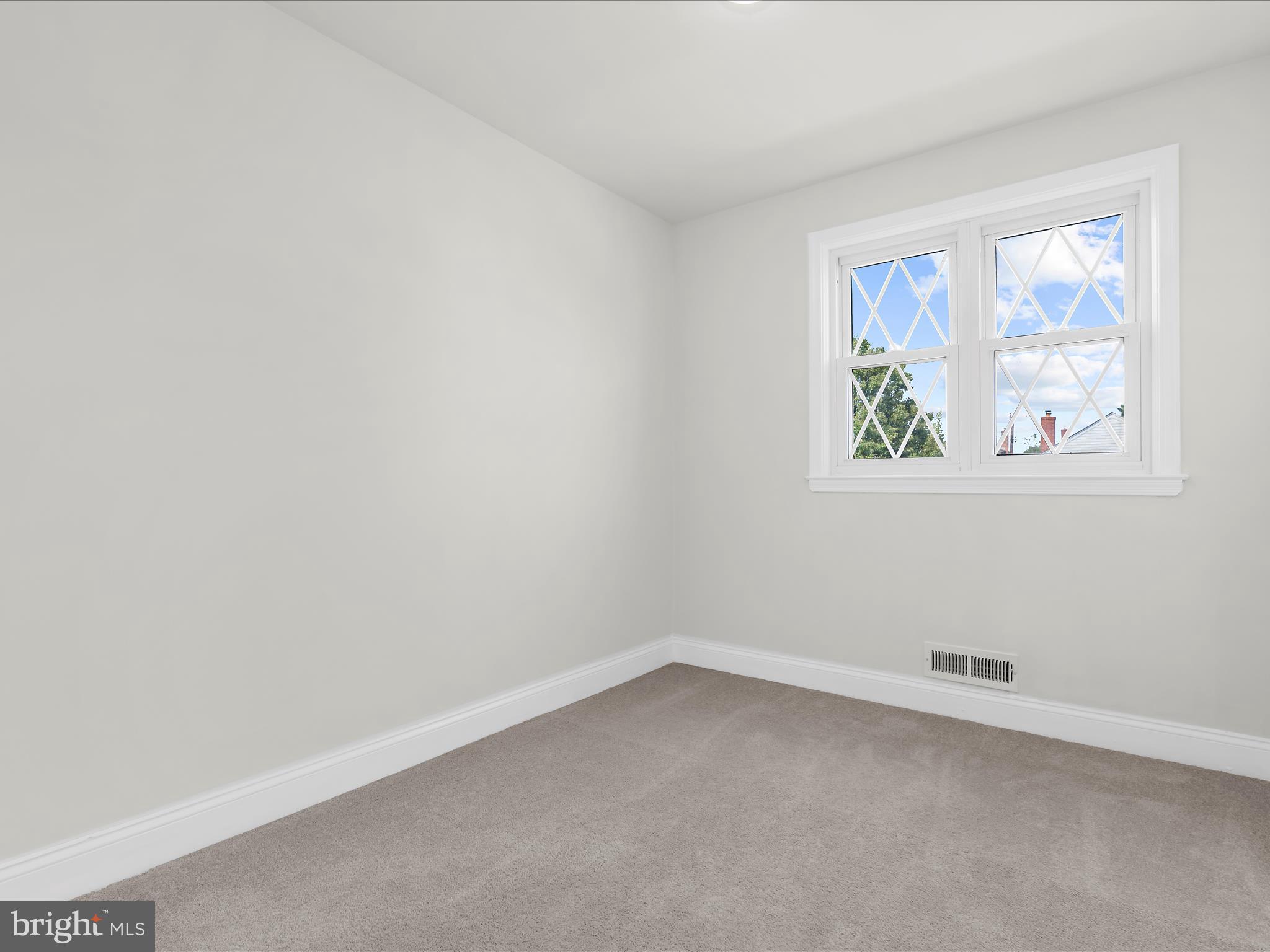 7821 Rockbourne Road Baltimore, MD 21222 - Photo 21 of 56 an empty room with a window
