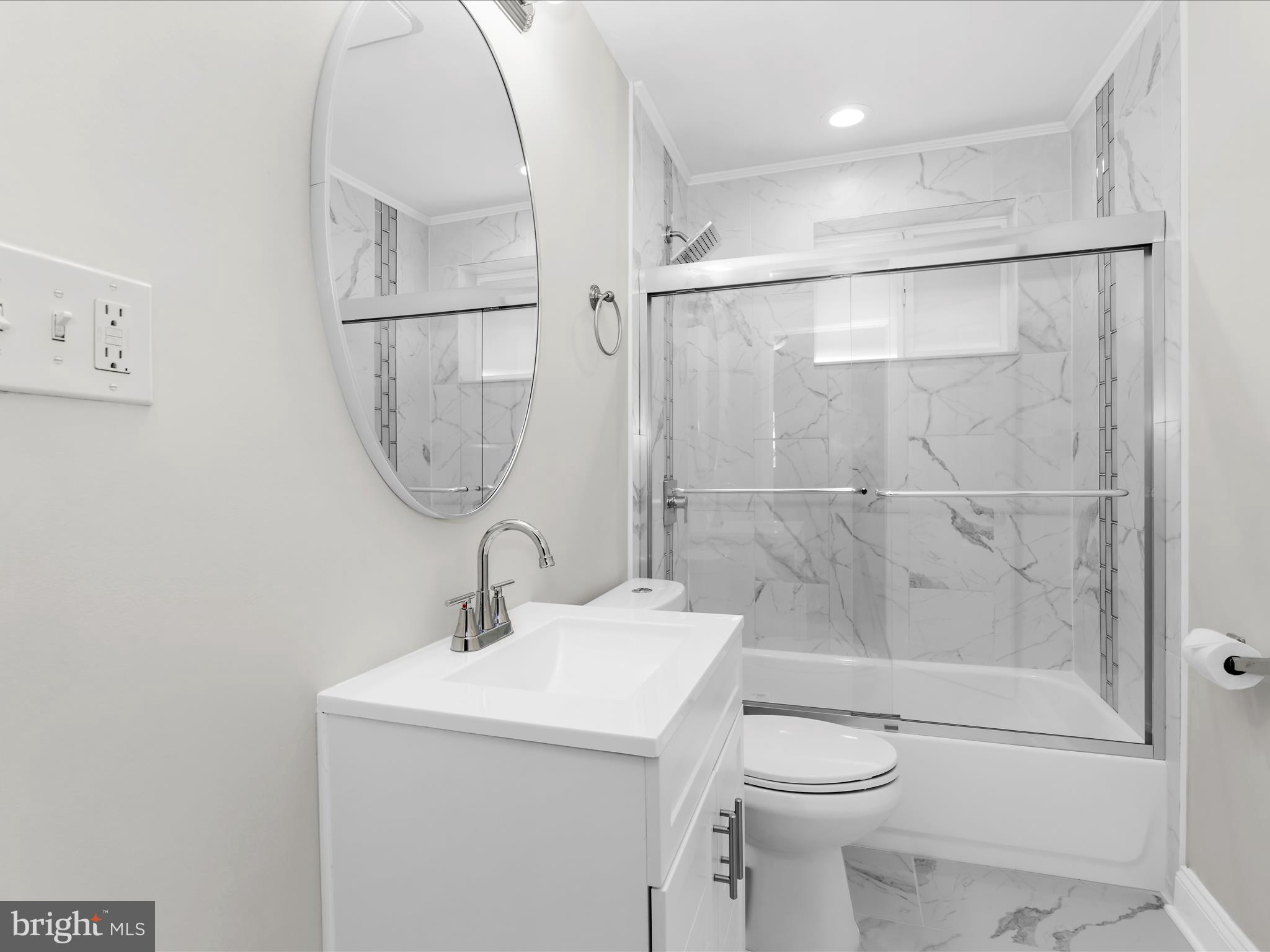 7821 Rockbourne Road Baltimore, MD 21222 - Photo 23 of 56 a bathroom with a sink toilet and shower