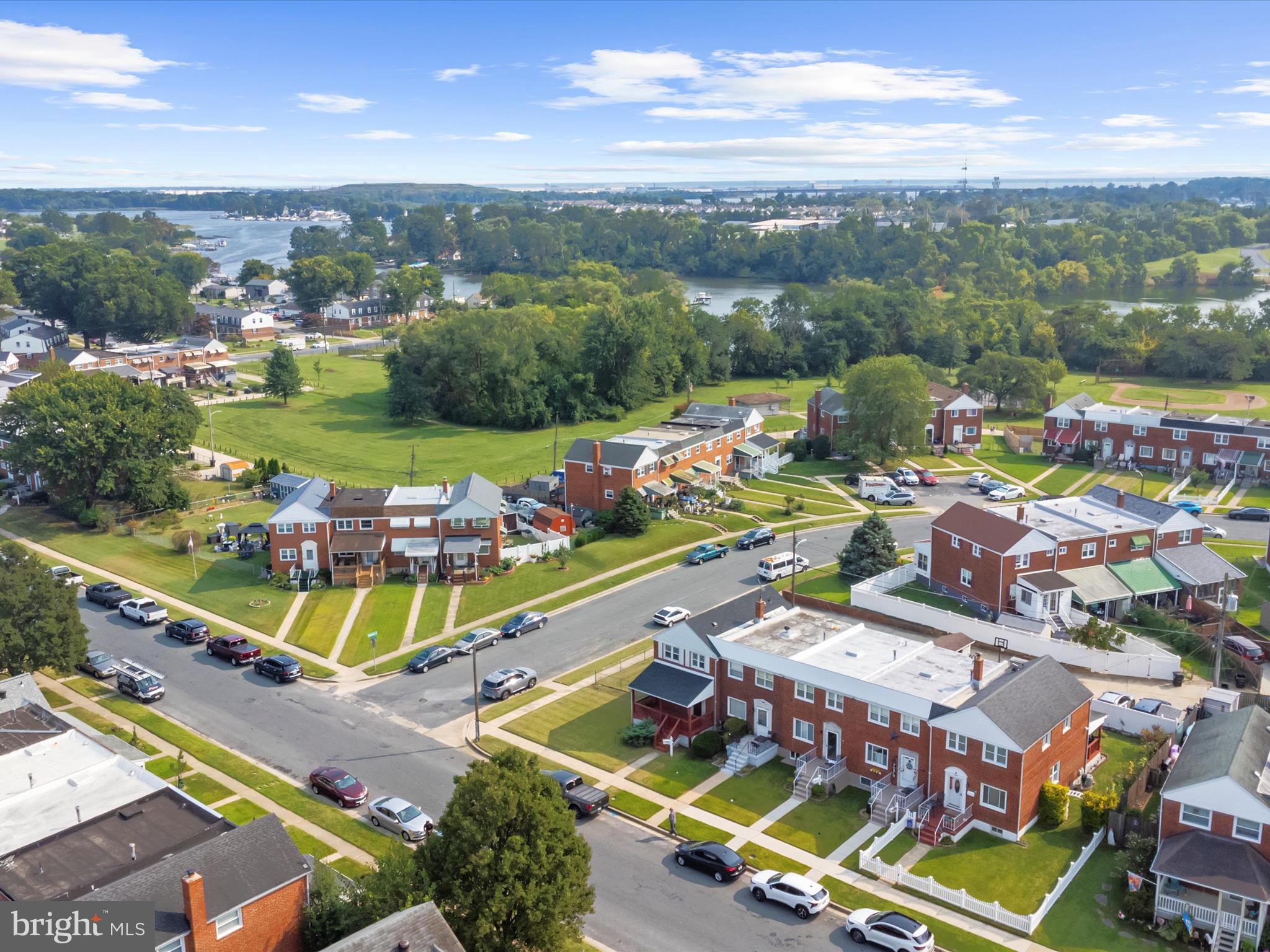7821 Rockbourne Road Baltimore, MD 21222 - Photo 40 of 56 an aerial view of a resort with swimming pool outdoor seating and yard
