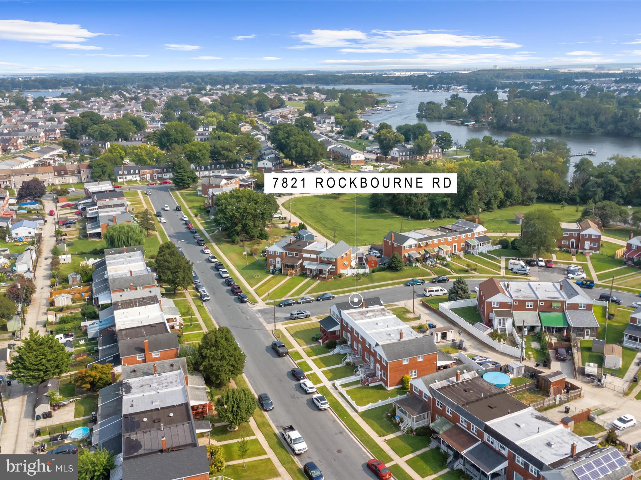 7821 Rockbourne Road Baltimore, MD 21222 - Photo 46 of 56 a view of a city with lots of residential buildings ocean and mountain view in back