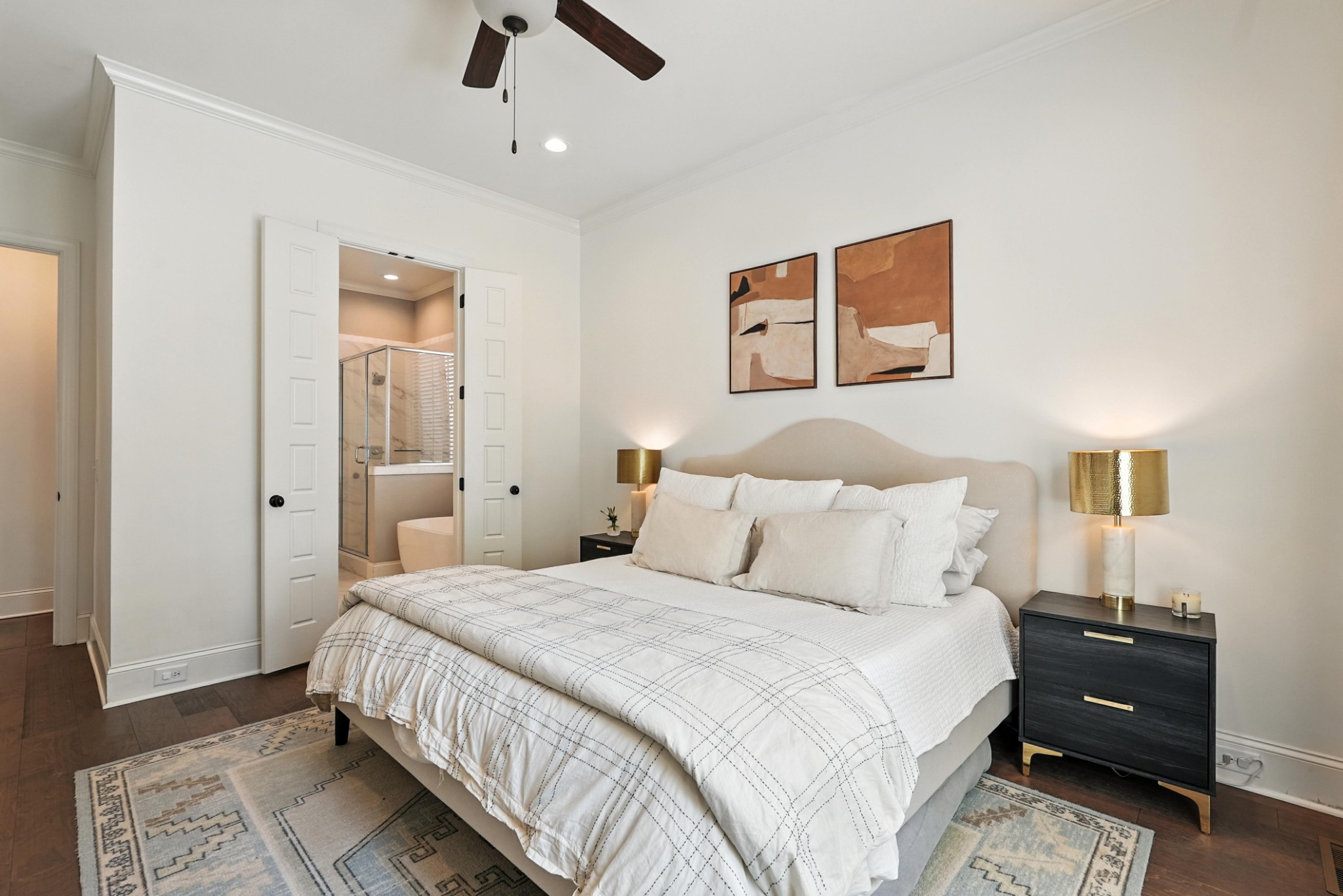 5542 Knob Road Nashville, TN 37209 - Photo 32 of 61 a bedroom with a bed and a chandelier