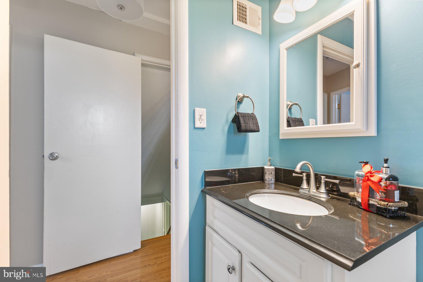 12703 Bluhill Road Silver Spring, MD 20906 - Photo 13 of 41 a bathroom with sink and mirror