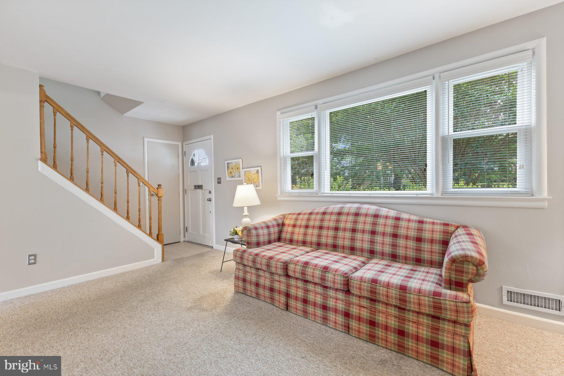 12703 Bluhill Road Silver Spring, MD 20906 - Photo 4 of 41 a living room with furniture and windows