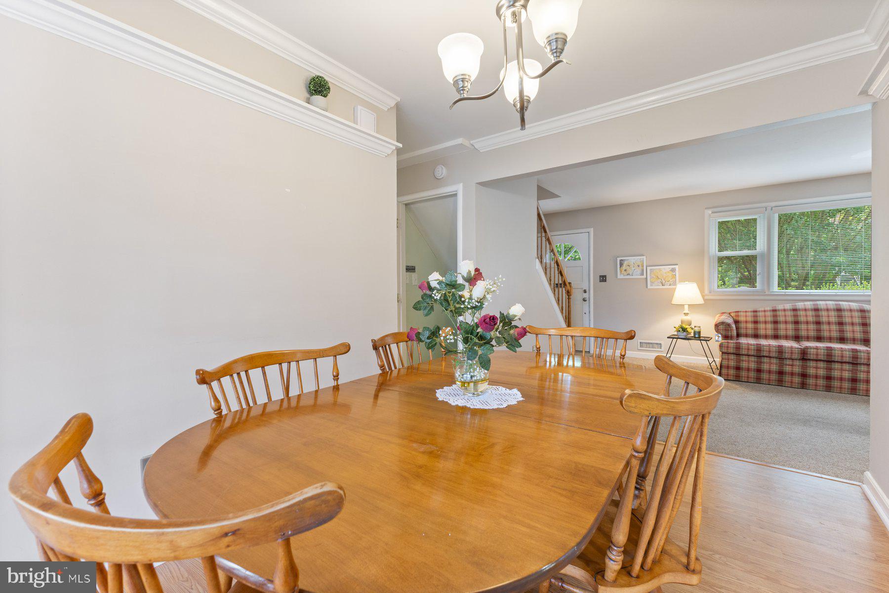 12703 Bluhill Road Silver Spring, MD 20906 - Photo 8 of 41 a view of a dining room with furniture and a chandelier