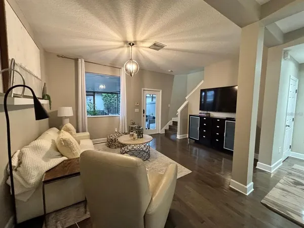 a living room with furniture and a flat screen tv